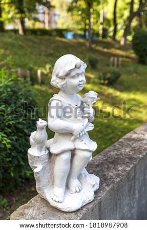 
Little angel statue in the park.