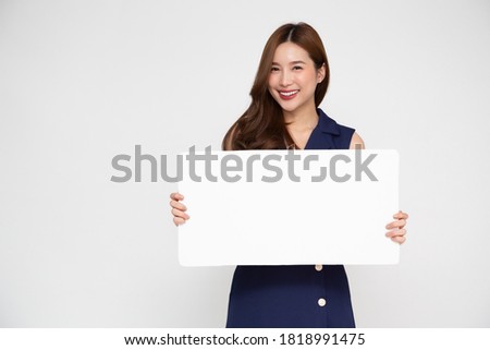 Young asian woman showing and holding blank white billboard isolated on white background