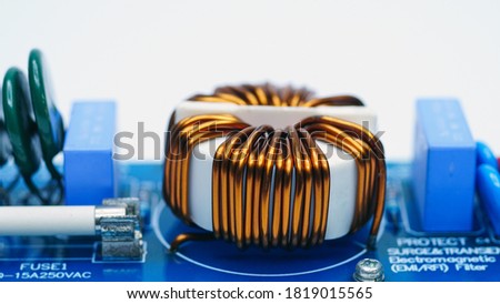electronic components on a printed circuit board.Inductors detail. Copper wire winding. Royalty-Free Stock Photo #1819015565
