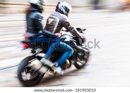 motorcyclist in motion blur Royalty-Free Stock Photo #181903010