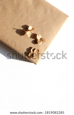 Holiday Gift Box Decorated with Dry Flowers. Holiday Season Mockup with Copy Space.