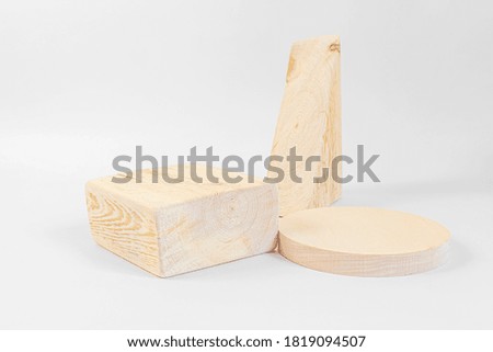 Wooden textured square, round and triangular podiums on a light background. Background for product photography, organic cosmetics, eco products. Geometric shape for product presentation.