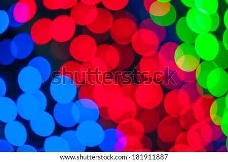 bokeh lights background. red, green and blue colour in dark tone