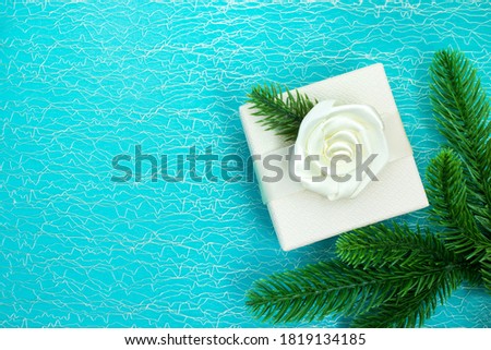 Christmas and New Year. Gift box and tree branches. Christmas composition with place for text. Christmas card mockup. Copy space. Top view.