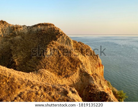 Beautiful sunset panoramic landscape of Stanislav clay mountains and canyons above Dnipro river bay near the Black sea, Ukraine, Kherson Grand Canyon.  Domestic tourism