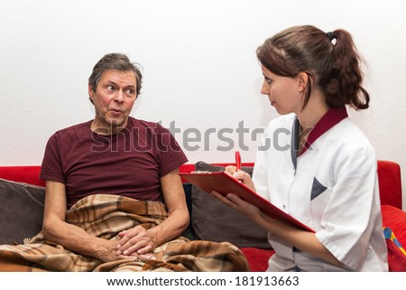 doctor with clipboard and senior adult