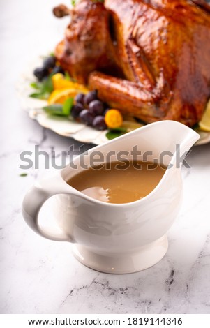 Homemade turkey gravy for Thanksgiving or Christmas dinner Royalty-Free Stock Photo #1819144346