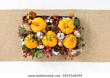 Autumn, fall thanksgiving table decoration, handmade centrepiece. Festive family dinner decore. Top view, flat lay