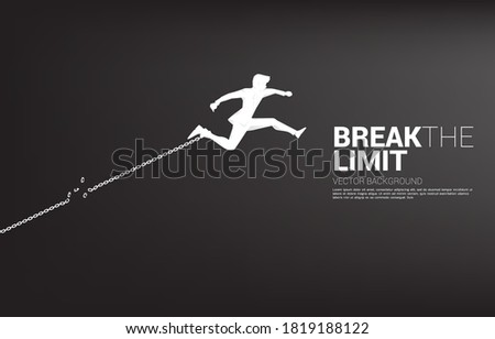 Silhouette of businessman jump to break the chain at foot. Concept of break the rule and limit in business. Royalty-Free Stock Photo #1819188122