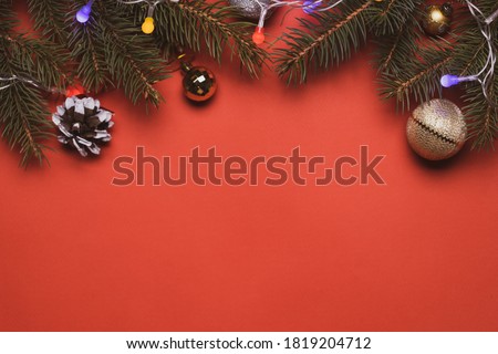 christmas decoration backdrop. above view christmas ornament over red moody background. greeting card template.