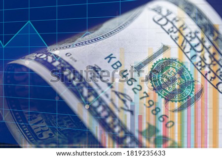 conceptual image on stock exchange, detail of 100 dollar bill in the background with graphs and bars Royalty-Free Stock Photo #1819235633