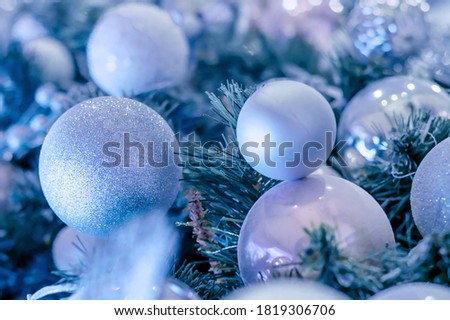 Christmas balls on a tree. Beautiful decorated Christmas tree with blue balls, Christmas background. Toned image