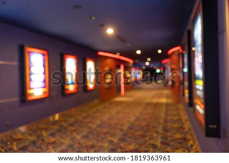 Movie theater entrance interior blur image use for background of business and cinema concept. Abstract blurred image of lobby of movie theater in Vietnam.