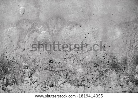 Abstract black and white colorless background, surface of old dirty cement wall with cracks and irregularities