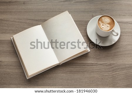 Photo blank open book on textured wood background with cape of coffee