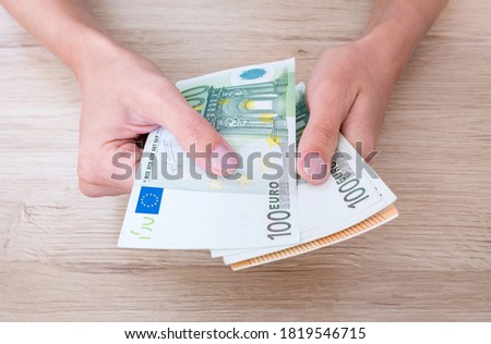 Euro cash in woman's hands. Royalty-Free Stock Photo #1819546715