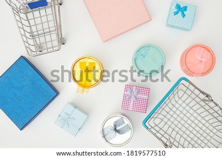 black friday concept, gift boxes with shopping trolley on white background, copy space, Flatlay