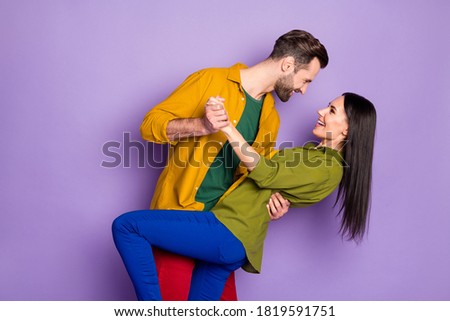 Profile side view portrait of his he/her she nice attractive cheerful cheery glad couple embracing dancing waltz having fun isolated on bright vivid shine vibrant lilac violet purple color background
