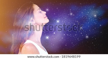Double exposure portrait of a young woman with galaxy space inside head. Royalty-Free Stock Photo #1819648199