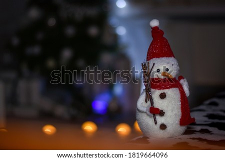 Little snowman close-up on a textured background