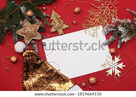 christmas layout and white lettering sheet on red fabric background