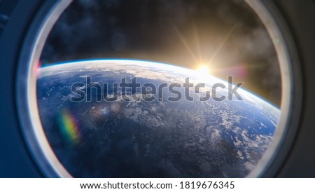 Breathtaking View of the Planet Earth from International Space Station Porthole. Rising Sun Illuminates Our Blue Planet's Clouds, Oceans and Peaceful Cities. Scientifically Accurate 3D VFX Rendering