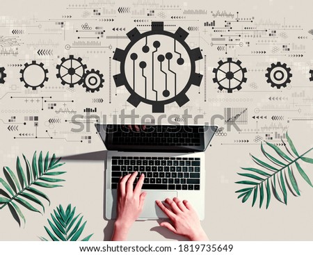 Automation concept with person using a laptop computer