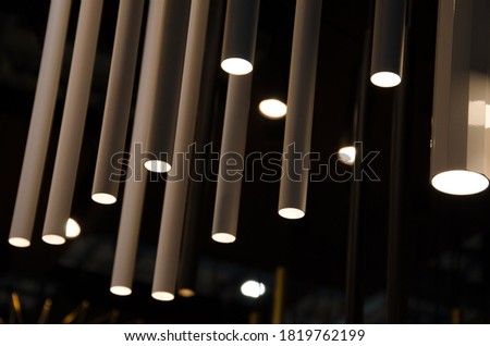 creative picture for the catalog. straight lines from tube shaped lamps