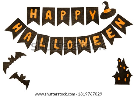 Happy Halloween with cut out letters, paper bat and other decorations isolated on white. paper art, halloween with kids concept