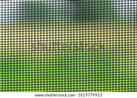 mosquito net on a green background close up