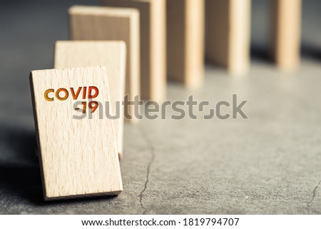 Covid-19 as first domino going to fall and impact to the others in a row Royalty-Free Stock Photo #1819794707