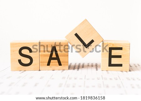 Word sale. Wooden small cubes with letters isolated on white background with copy space available.Business Concept image.