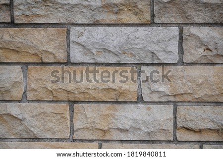 Old grey brick wall texture background. Civil and industrial construction.