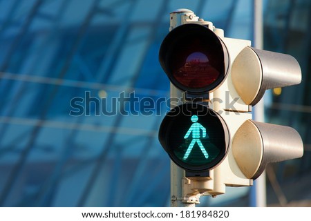 Traffic light on green Royalty-Free Stock Photo #181984820