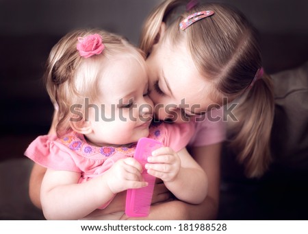 Two sister's showing affection to each other