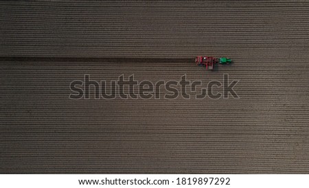 Tractor in the field top view
