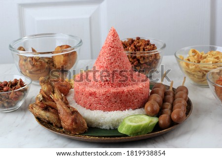 Red and White  Rice Called Nasi Tumpeng Same as Indonesian National Flag for Independence Day Celebration at 17 August. Tumpeng Merah Putih Royalty-Free Stock Photo #1819938854