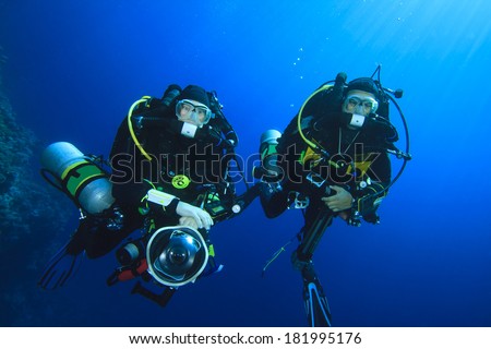 Two technical scuba divers using closed-circuit rebreathers Royalty-Free Stock Photo #181995176