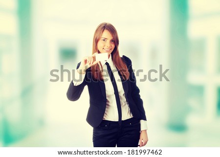 Beautiful young business woman with blank business card  