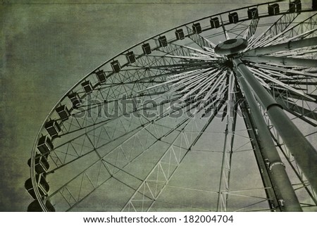 Big wheel.  Cross processed to look like an aged instant picture with textures and greenish background