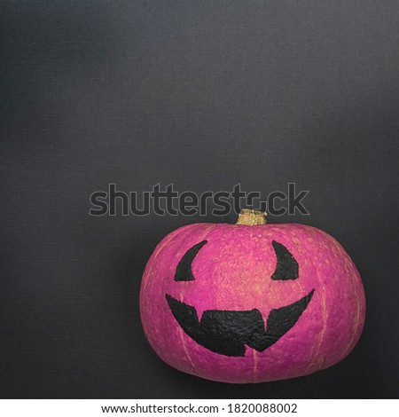 Happy Halloween creative Pink pumpkin with funny smile on Black Square background                                