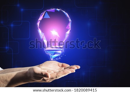 Hands holding glowing polygonal light bulb on dark blue background. Innovation and idea concept