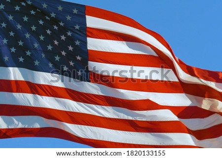 CLOSE UP: American flag waving in wind. Realistic USA Flag background. American Flag. Waved highly detailed fabric texture. American flag flying in the wind at sunny day