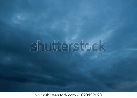 Dark blue, storm clouds in the sky