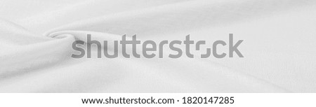 Silk fabric in white. Grunge surface texture with fine grains, dots, abstract background. Monochrome background from thin material. Overlay template