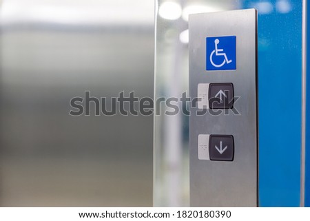 Image of disabled lift button. Stainless steel elevator panel push buttons for blind and disability people. Push Button For the disabled. Care and technology. Elevator buttons for disabled people.