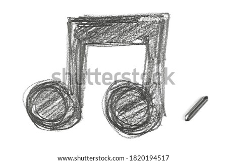 Graphite stick with musical note hatching, sketching isolated on white background, top view