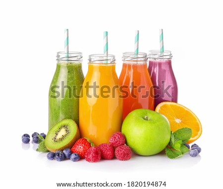 Set of fruit juices in glass bottles isolated on white background. Royalty-Free Stock Photo #1820194874
