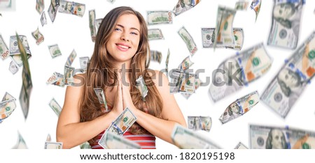 Beautiful caucasian young woman wearing casual clothes praying with hands together asking for forgiveness smiling confident.