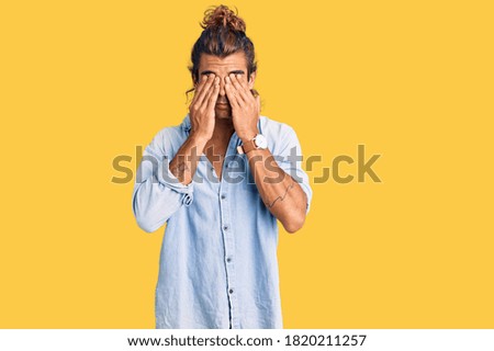 Young hispanic man wearing summer style rubbing eyes for fatigue and headache, sleepy and tired expression. vision problem 